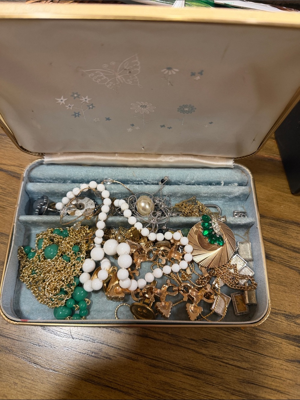 Vintage jewelry box with misc Sara cov jewelry. Cuff links and a Boucher pendant